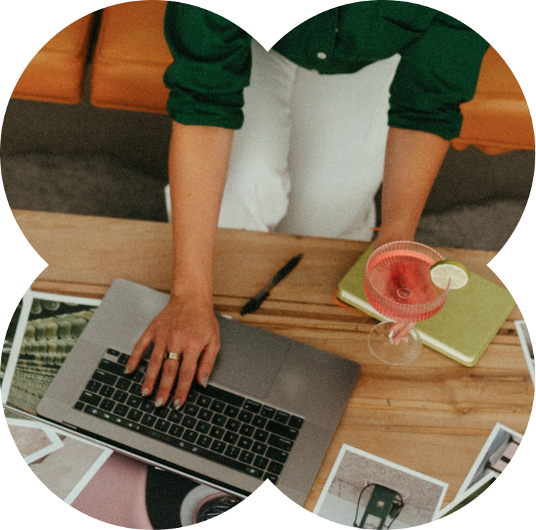 Laptop and photos on a table